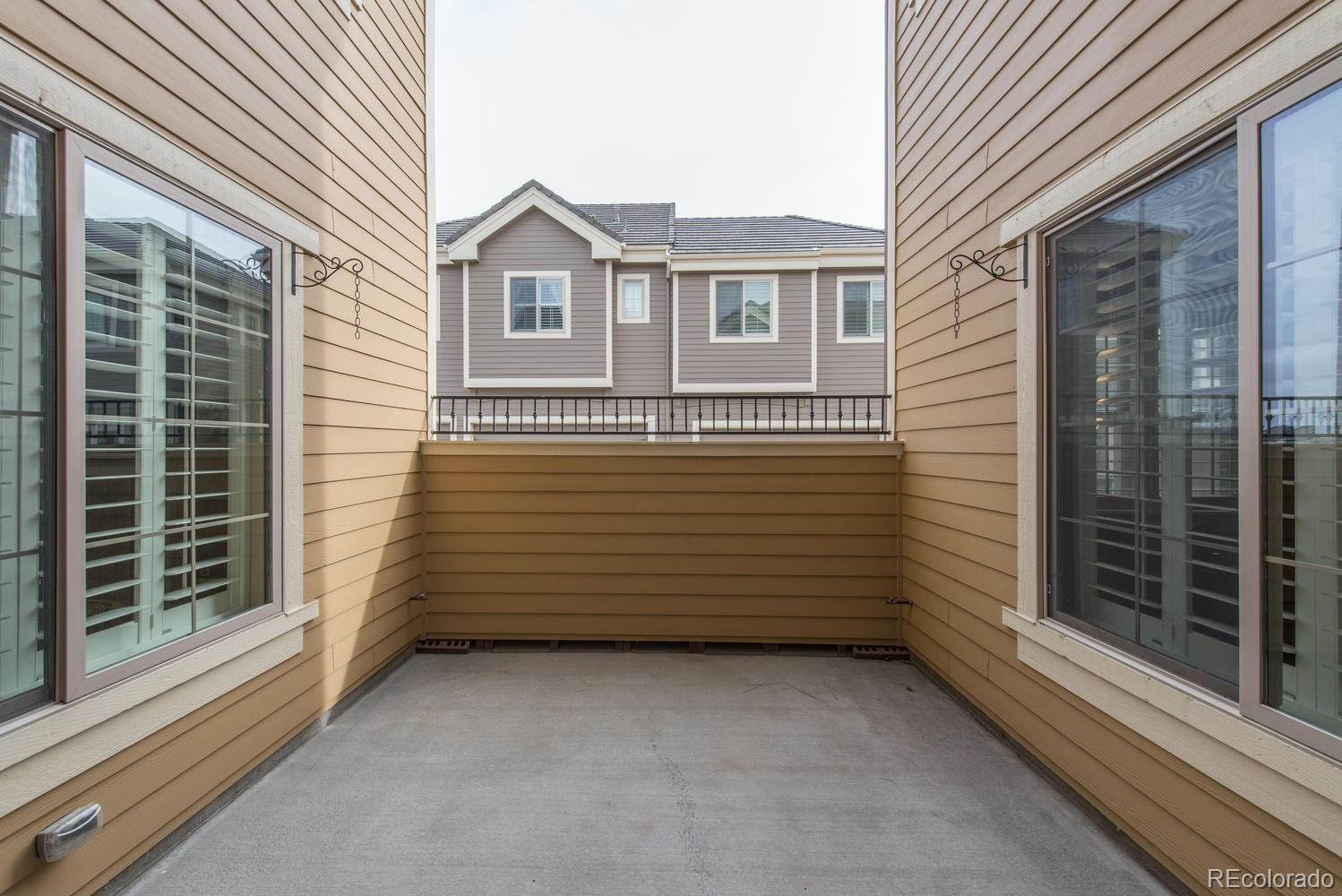 9250 Ridgegate Parkway Lone Tree, CO 80124 - Photo 30 of 33 a view of a house with a wooden fence