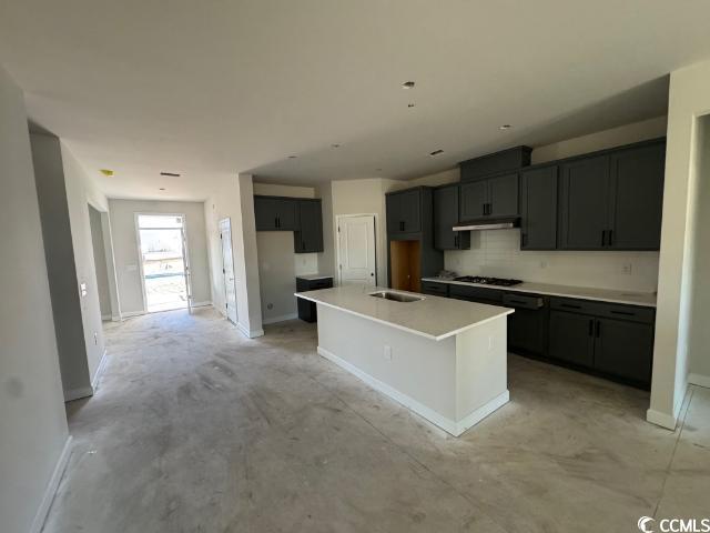 3080 Palma Way Myrtle Beach, SC 29579 - Photo 5 of 18 Kitchen with sink, decorative backsplash, gas cook