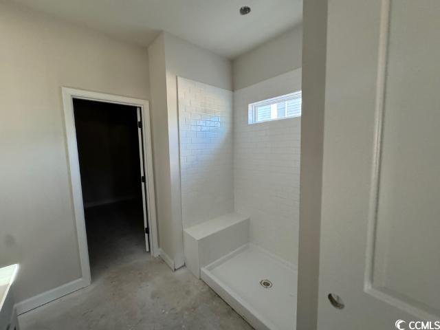 3080 Palma Way Myrtle Beach, SC 29579 - Photo 10 of 18 Bathroom with a tile shower and concrete flooring