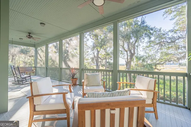 a view of a room with balcony and furniture