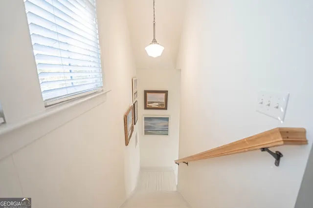a view of a hallway with closet