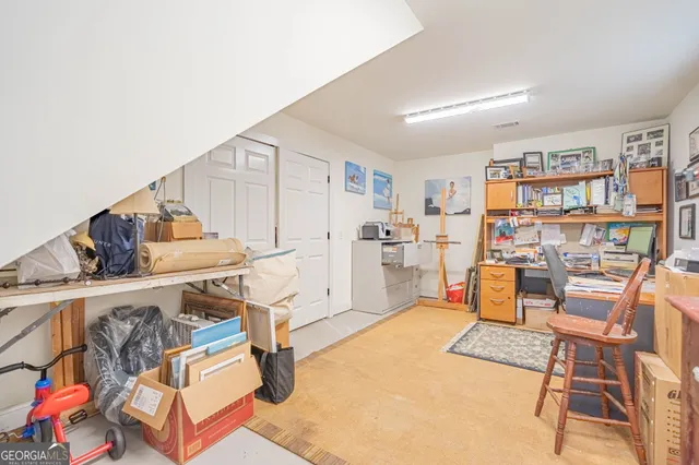 a view of a workspace with furniture