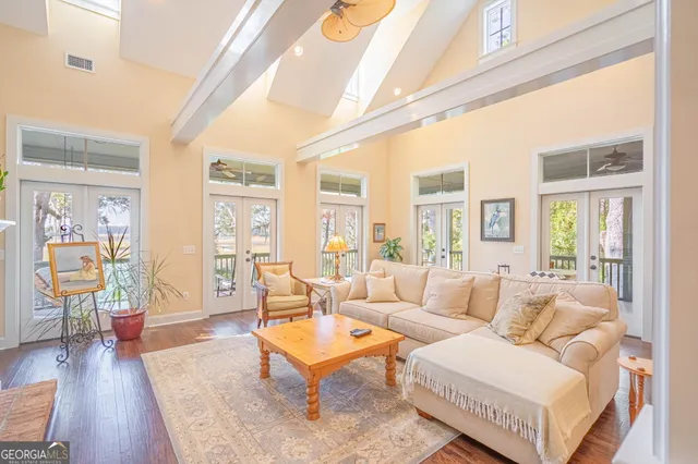 a living room with furniture and wooden floor