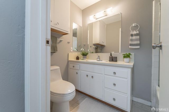 a dining room with furniture and a potted plant