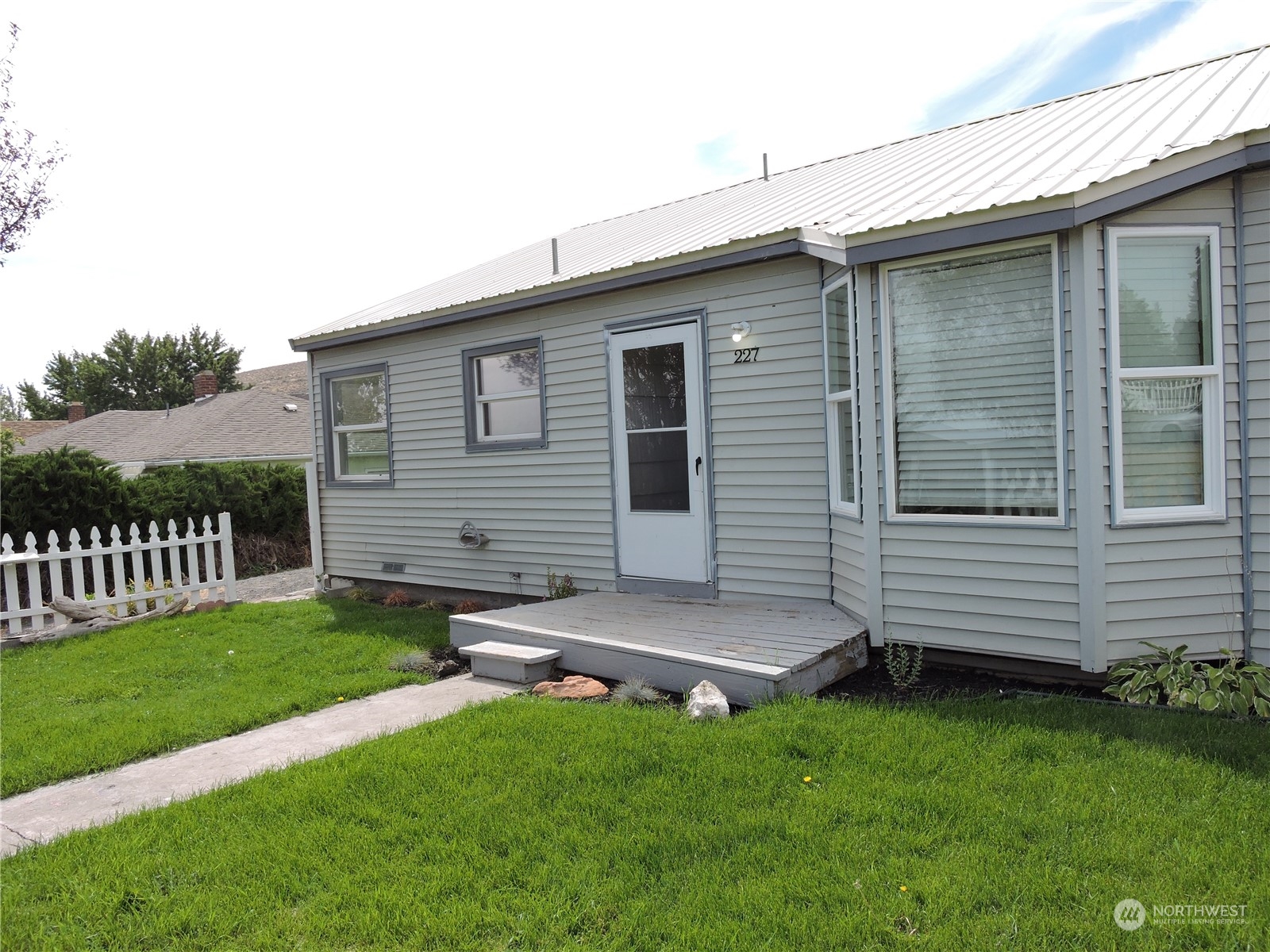 227 Columbia Road Ephrata, WA 98823 - Photo 1 of 21 a backyard of a house with a garden