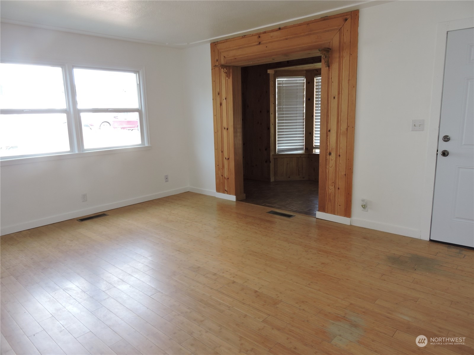 227 Columbia Road Ephrata, WA 98823 - Photo 4 of 21 an empty room with wooden floor and windows