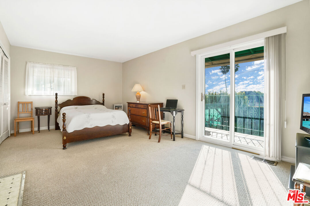 1215 North Everett Street Glendale, CA 91207 - Photo 18 of 31 a bedroom with a bed and a large window