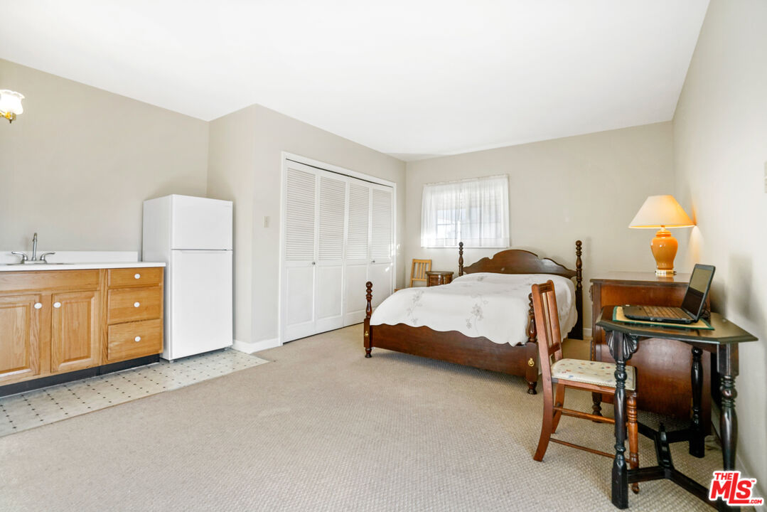 1215 North Everett Street Glendale, CA 91207 - Photo 19 of 31 a bedroom with a bed and cabinets