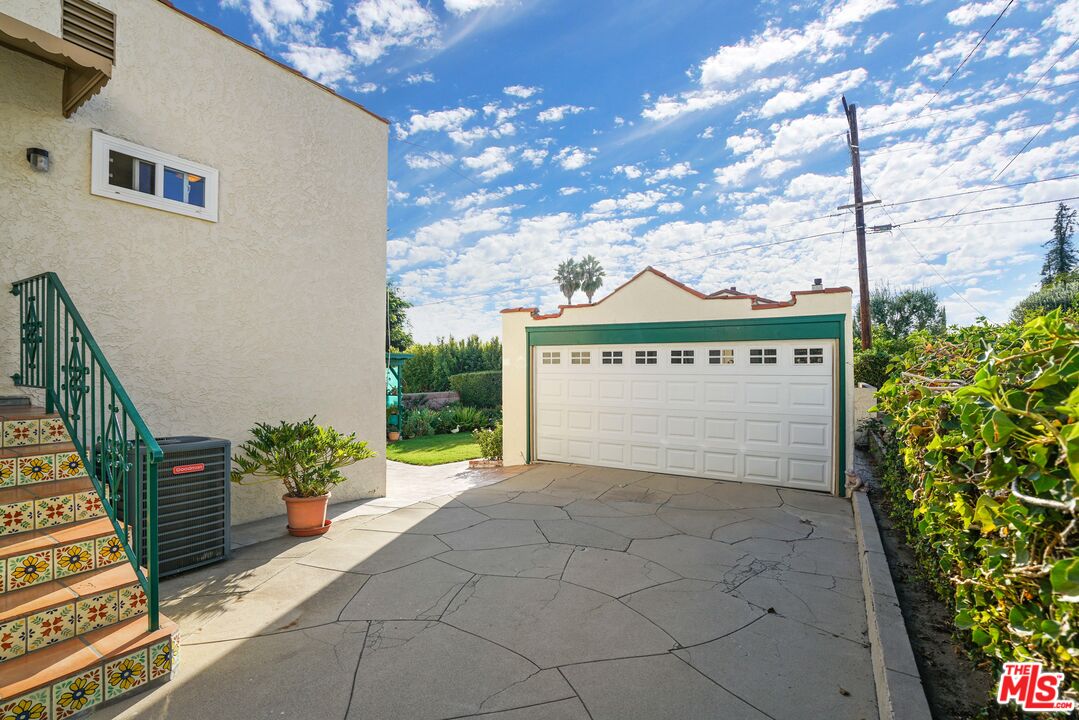 1215 North Everett Street Glendale, CA 91207 - Photo 21 of 31 a view of a house with a yard and potted plants