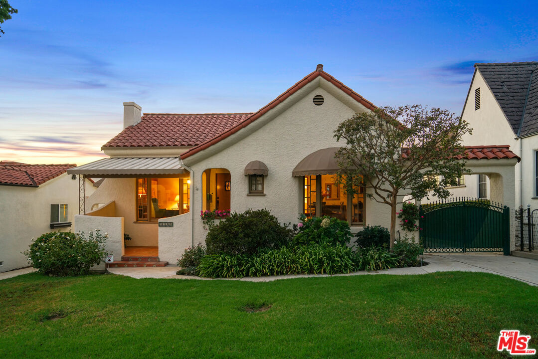 1215 North Everett Street Glendale, CA 91207 - Photo 26 of 31 a front view of a house with a yard and garage