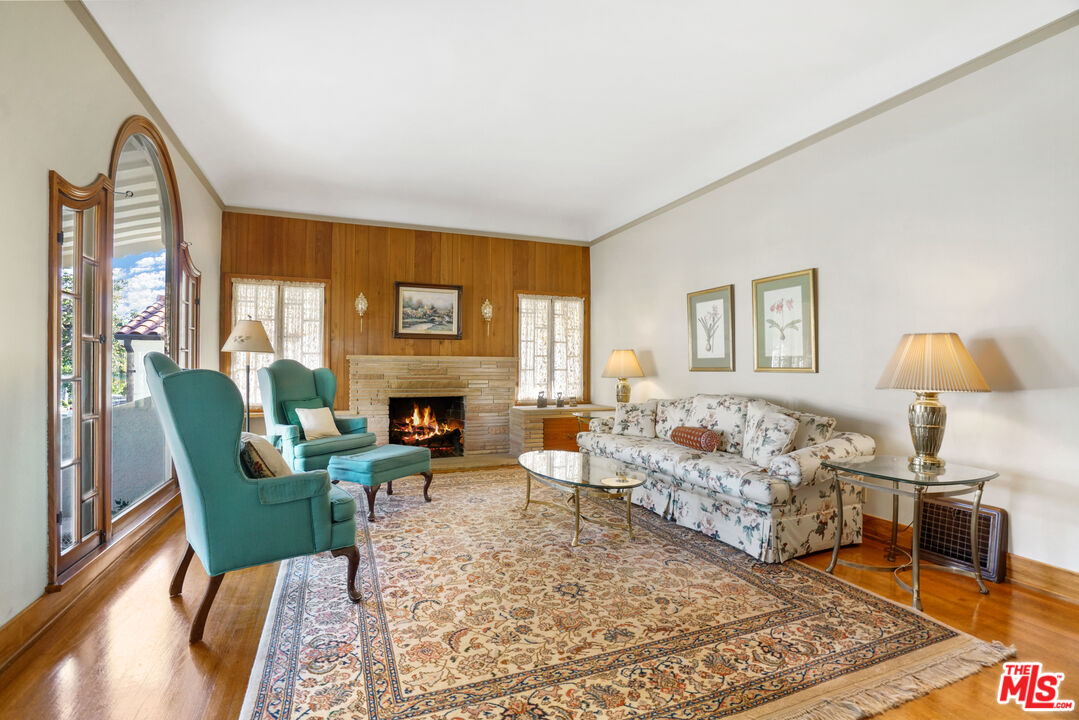 1215 North Everett Street Glendale, CA 91207 - Photo 5 of 31 a living room with furniture and a fireplace