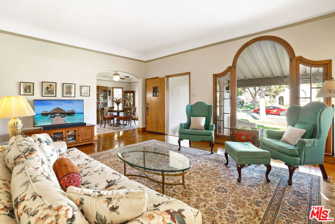 1215 North Everett Street Glendale, CA 91207 - Photo 6 of 31 a living room with furniture a rug and a large window