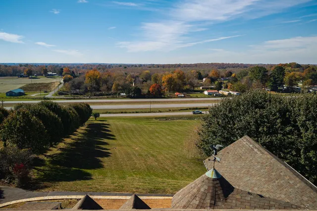 a view of a fountain in front of a house