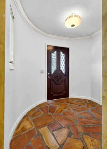 a kitchen with granite countertop a sink and a stove