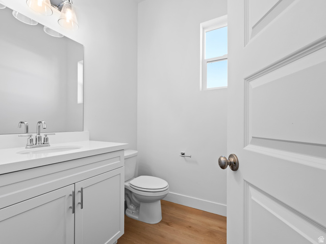 18 South Crimson Way, Unit 304 Mapleton, UT 84664 - Photo 10 of 17 Half bath featuring light wood finished floors and vanity