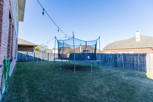 a house view with a backyard space