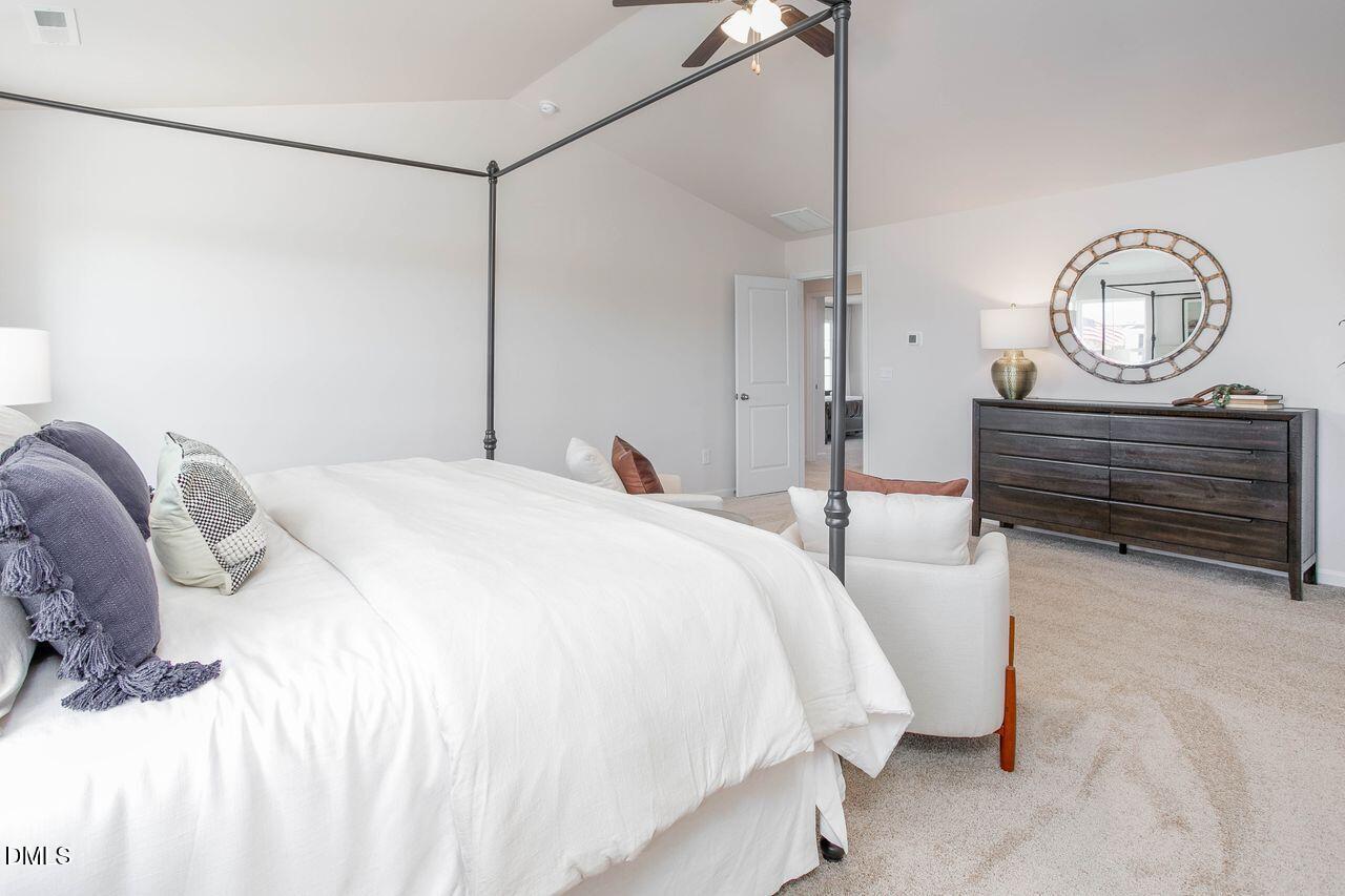 7070 Stockard Road Snow Camp, NC 27349 - Photo 24 of 38 a bed room with a bed mirror and a table