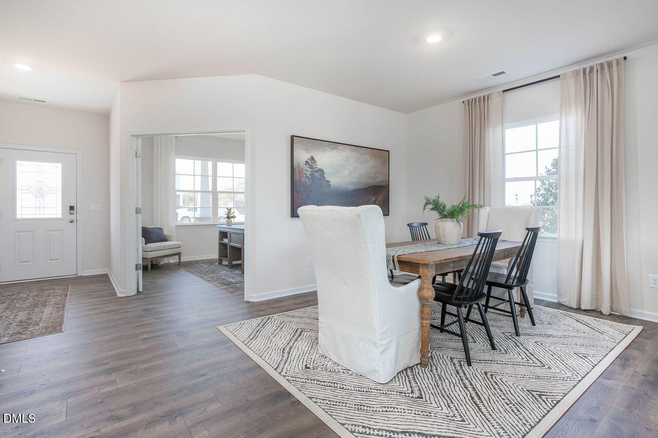 7070 Stockard Road Snow Camp, NC 27349 - Photo 6 of 38 a view of a dining room with furniture and wooden floor