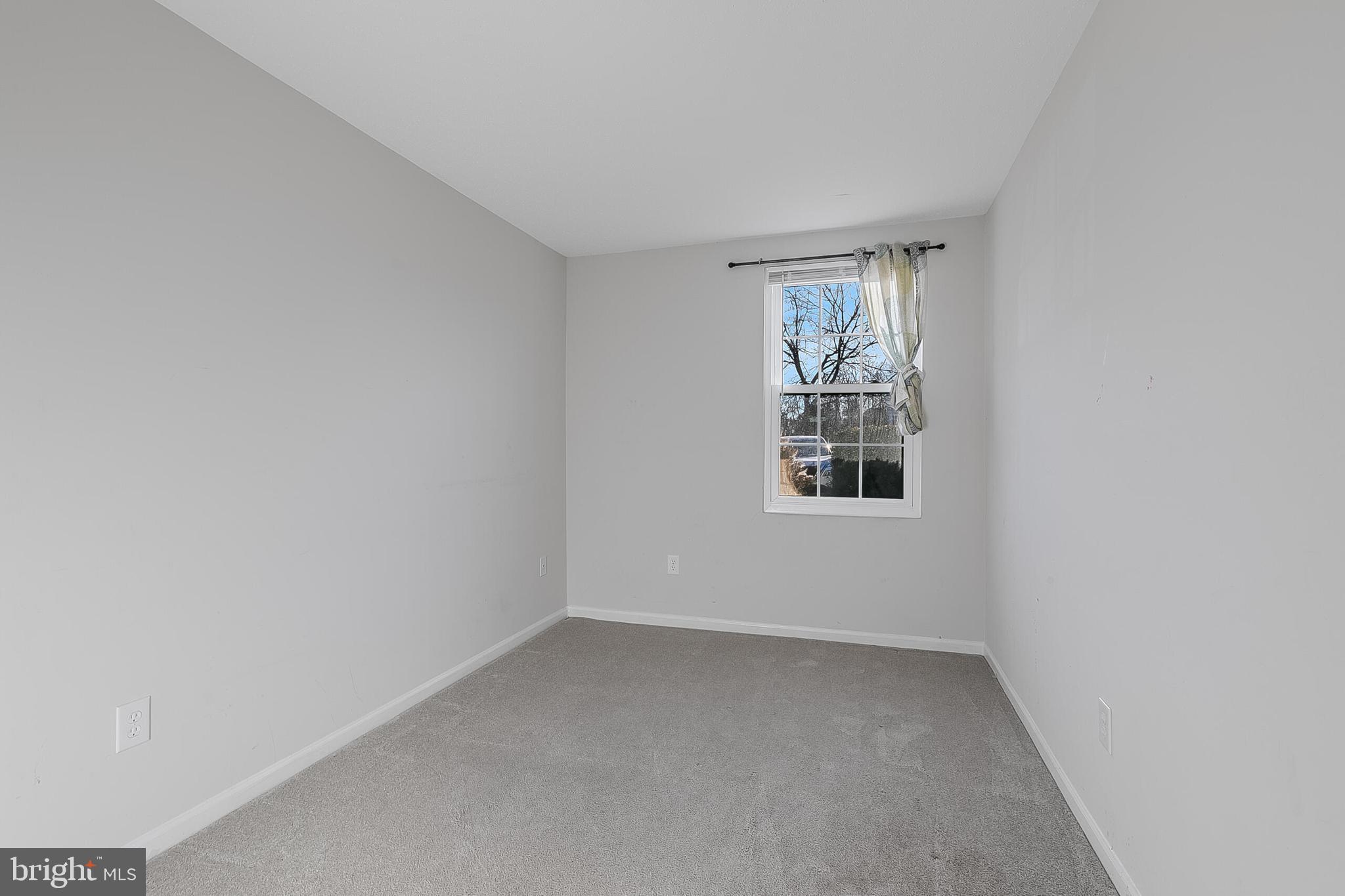 110 Prosperity Avenue Southeast, Unit A Leesburg, VA 20175 - Photo 13 of 22 an empty room with a window