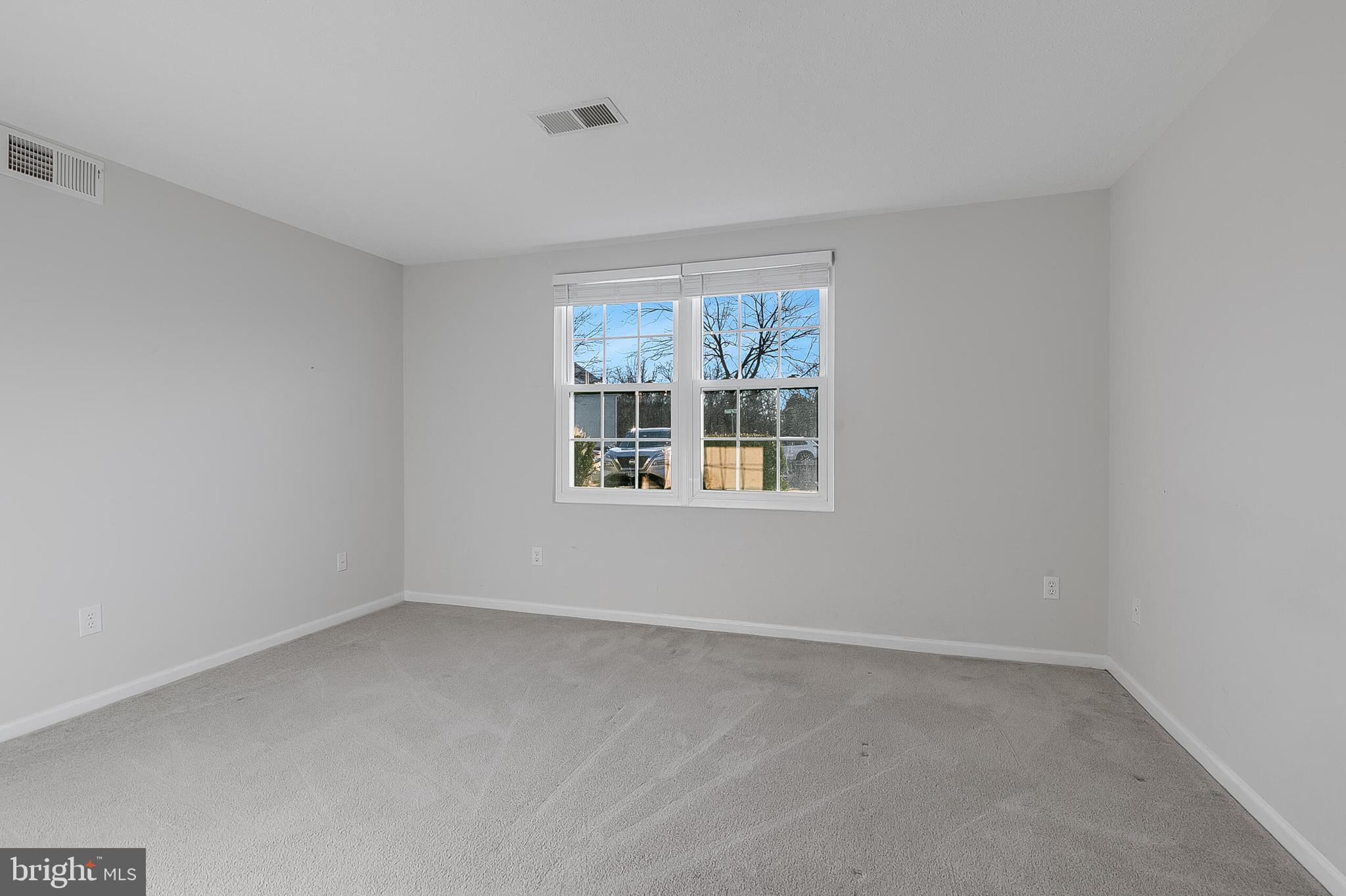 110 Prosperity Avenue Southeast, Unit A Leesburg, VA 20175 - Photo 18 of 22 an empty room with windows