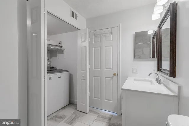 a bathroom with a sink and mirror