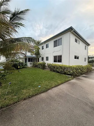 a view of house with outdoor seating