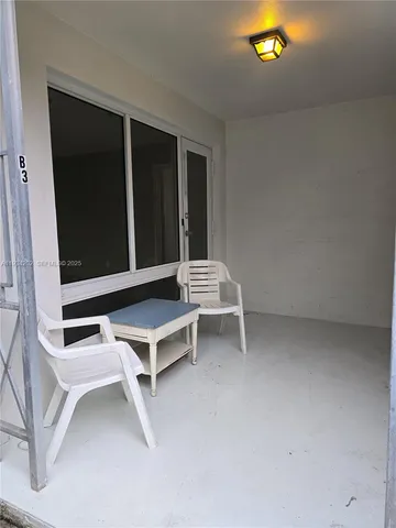 a wooden bench sitting in a room