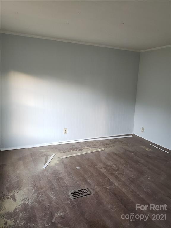 1158 Wagon Wheel Road, Unit 5 Hickory, NC 28602 - Photo 5 of 10 a view of an empty room and wooden floor