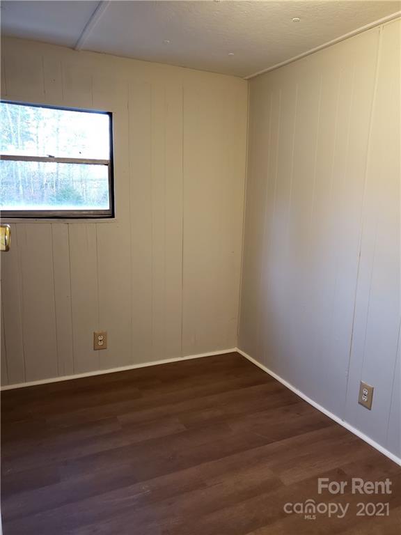 1158 Wagon Wheel Road, Unit 5 Hickory, NC 28602 - Photo 6 of 10 a view of a small space with wooden floor and a window