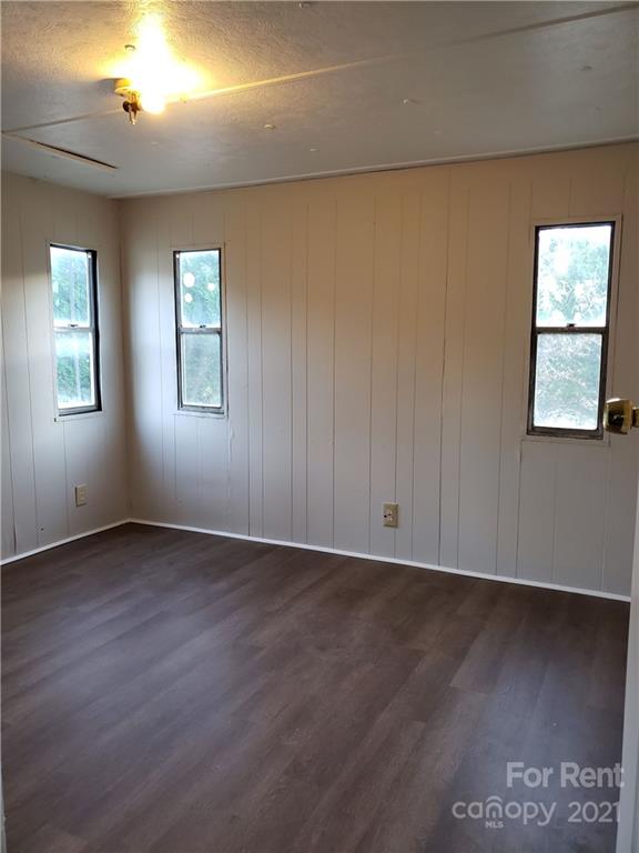 1158 Wagon Wheel Road, Unit 5 Hickory, NC 28602 - Photo 7 of 10 an empty room with wooden floor and windows