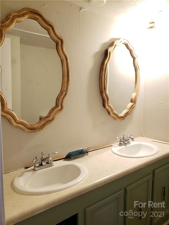 1158 Wagon Wheel Road, Unit 5 Hickory, NC 28602 - Photo 9 of 10 a bathroom with a sink and a mirror