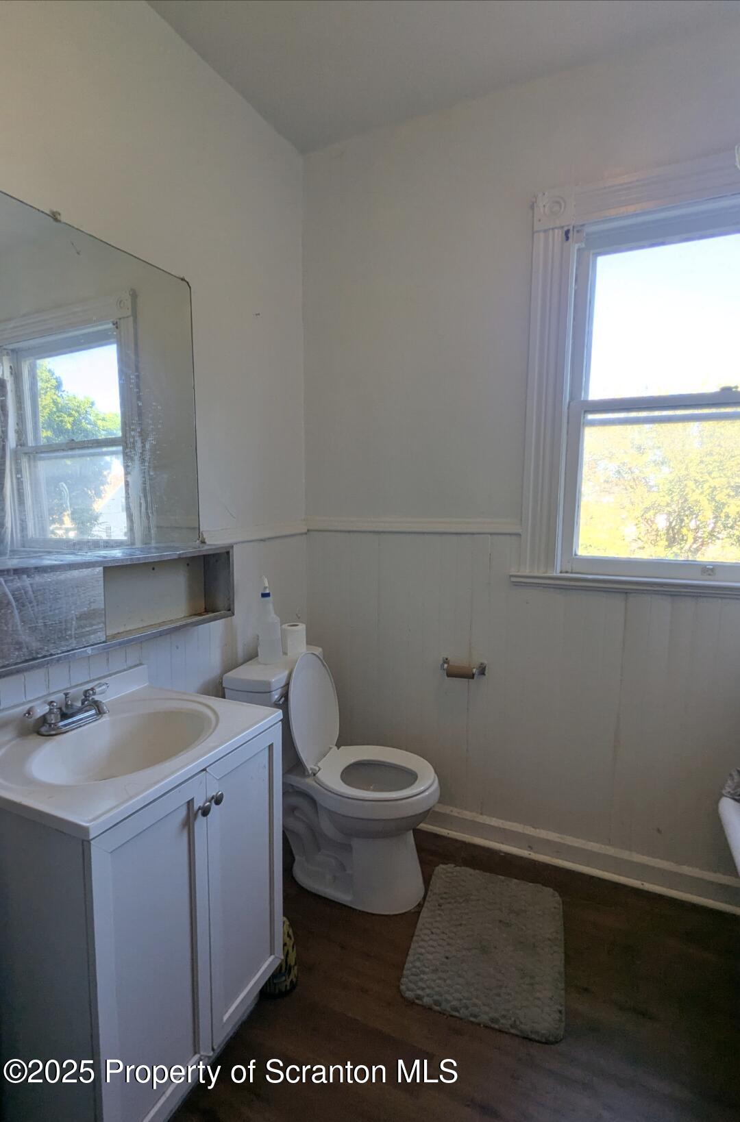 1220 Schlager Street Scranton, PA 18504 - Photo 6 of 10 a bathroom with a toilet sink and window