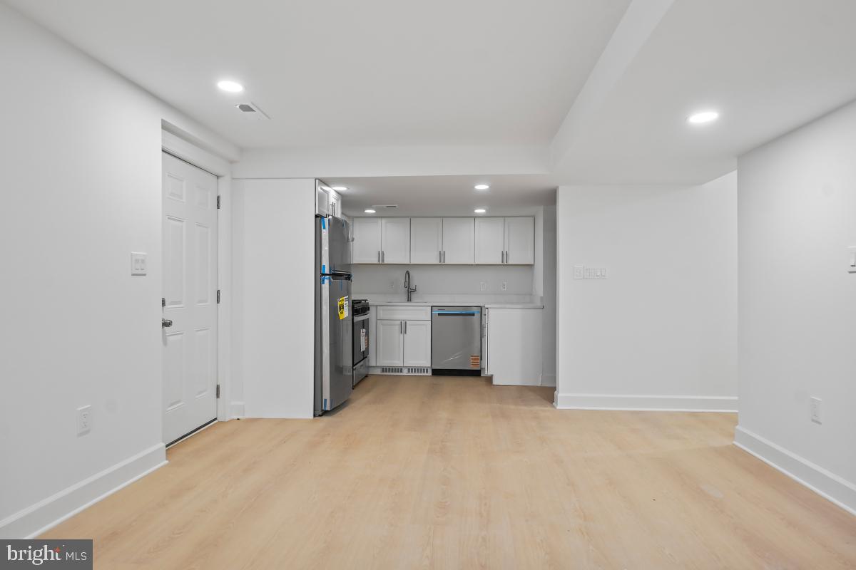 8728 # Courthouse Road Vienna, VA 22182 - Photo 11 of 34 a view of a kitchen with a sink and white cabinets