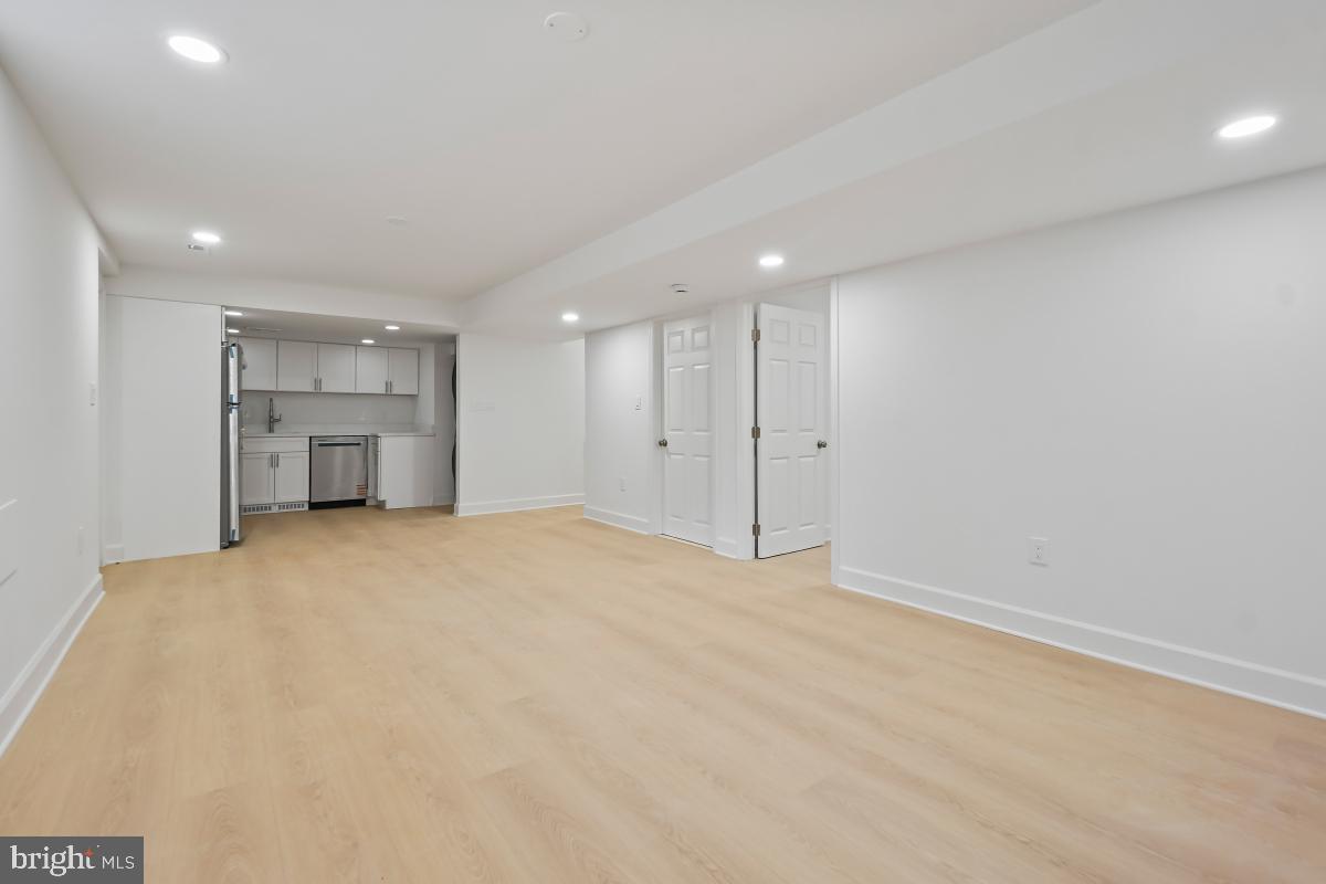 8728 # Courthouse Road Vienna, VA 22182 - Photo 11 of 34 a view of empty room with a kitchen