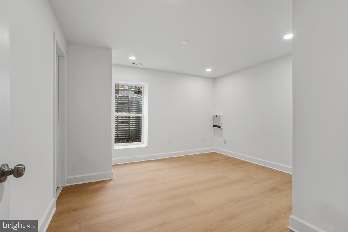 8728 # Courthouse Road Vienna, VA 22182 - Photo 17 of 34 a view of an empty room with a window