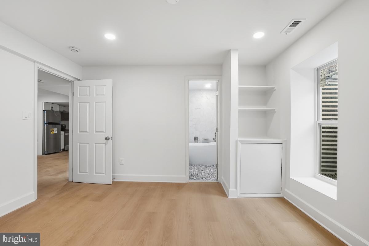 8728 # Courthouse Road Vienna, VA 22182 - Photo 20 of 34 a view of an empty room with a window