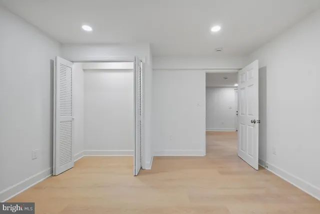 a white bath tub sitting in a bathroom and shower