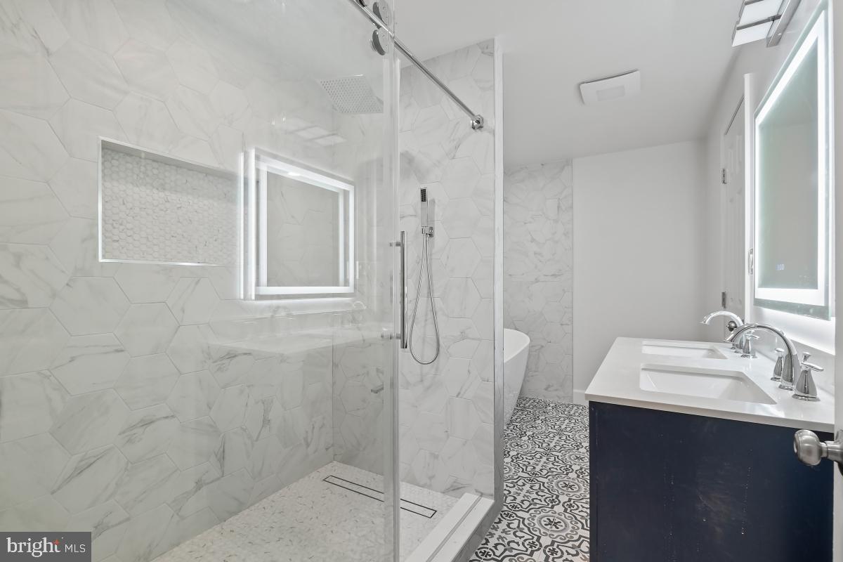 8728 # Courthouse Road Vienna, VA 22182 - Photo 26 of 34 a bathroom with a sink a toilet and shower