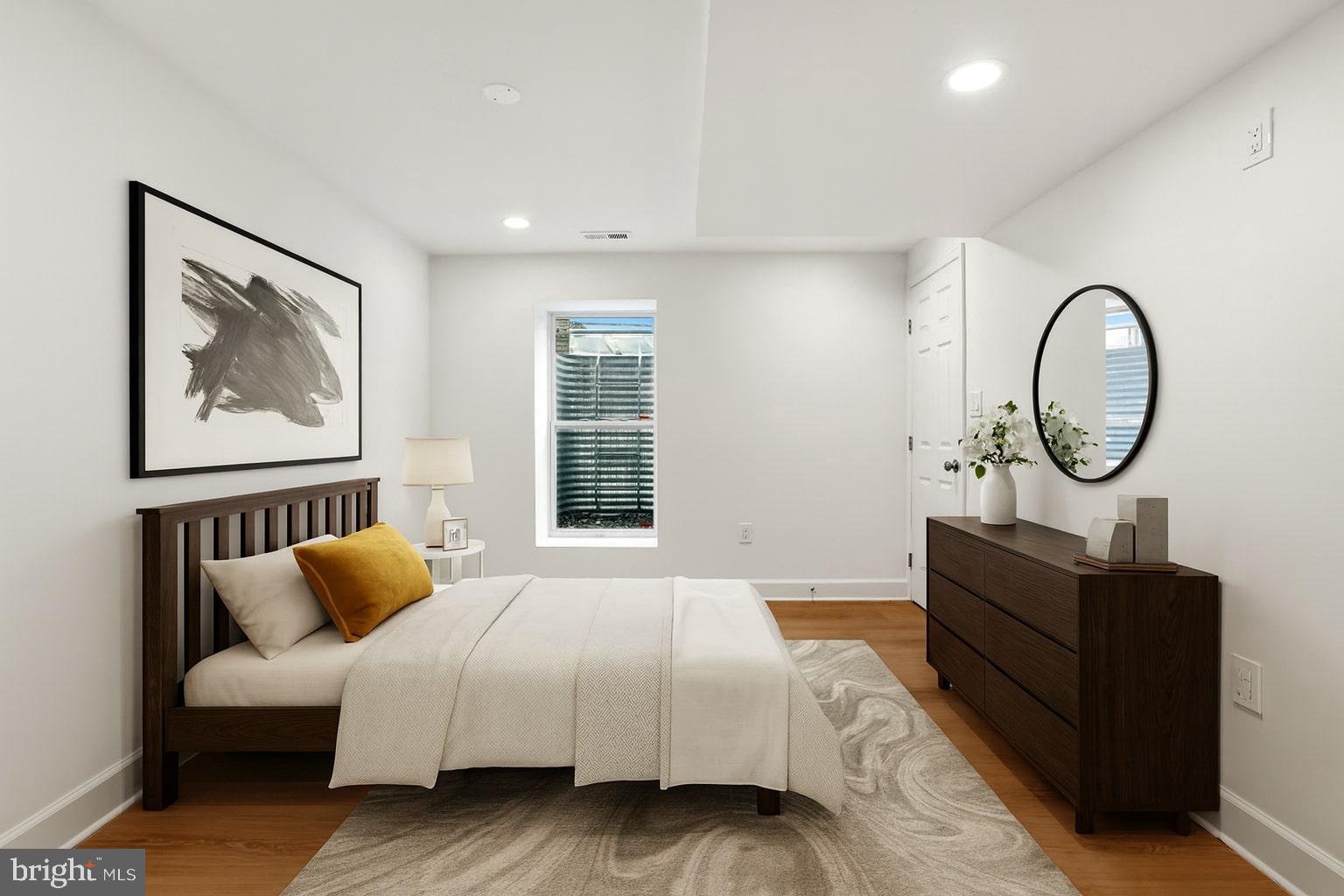 8728 # Courthouse Road Vienna, VA 22182 - Photo 29 of 34 a bedroom with a bed mirror and window