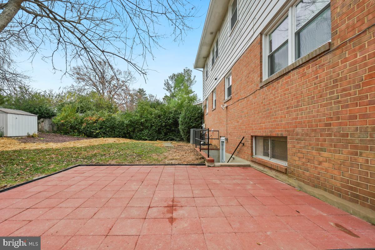 8728 # Courthouse Road Vienna, VA 22182 - Photo 32 of 34 a view of a house with backyard and trees