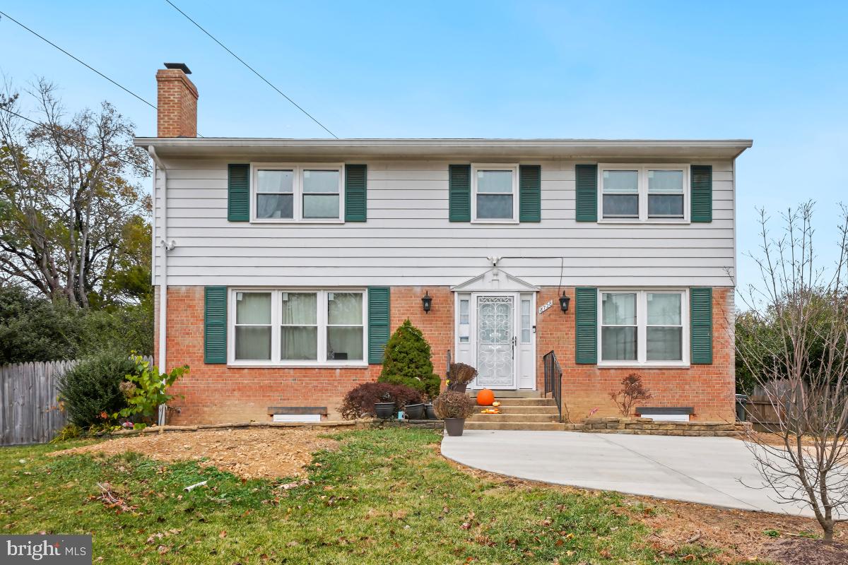 8728 # Courthouse Road Vienna, VA 22182 - Photo 33 of 34 a front view of a house with garden