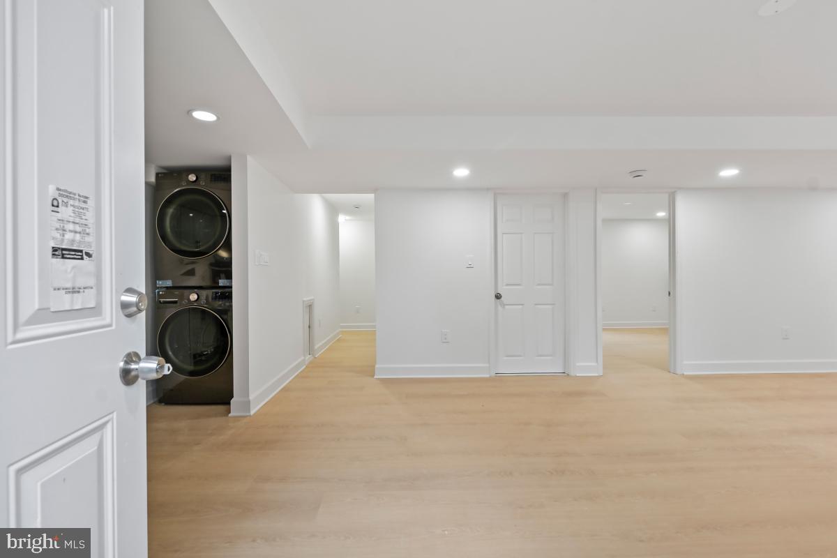 8728 # Courthouse Road Vienna, VA 22182 - Photo 5 of 34 a view of a hallway with washer and dryer