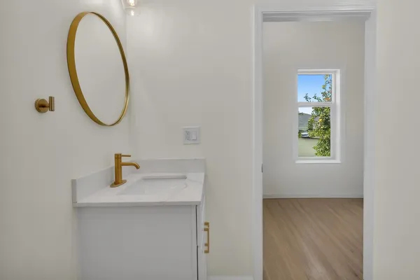 a bathroom with a sink and a mirror