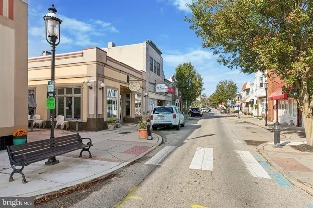 a building exterior with stairs and bench