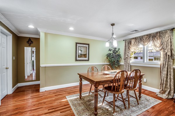 15 Lillian Road Lexington, MA 02420 - Photo 12 of 30 a view of a dining room with furniture window and wooden floor