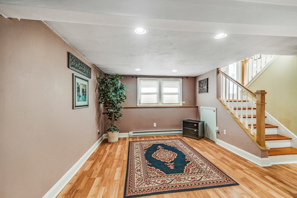 15 Lillian Road Lexington, MA 02420 - Photo 28 of 30 a living room with furniture and a rug