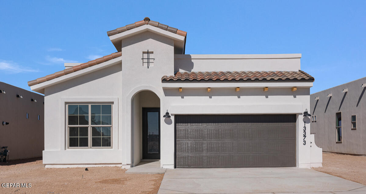 a front view of a house with a garage