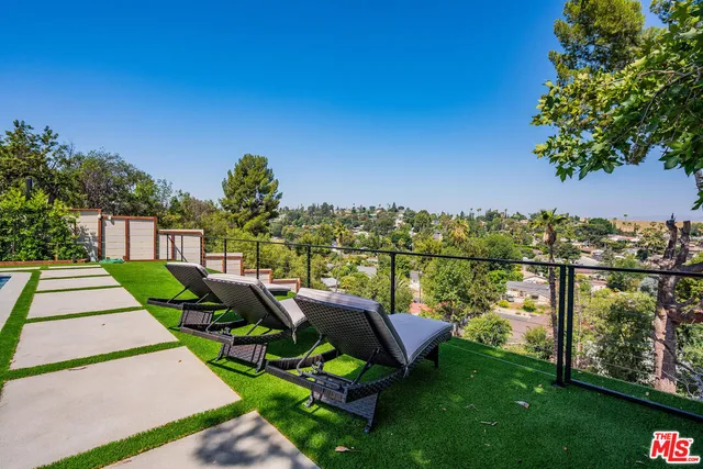 a view of an outdoor sitting area with chairs