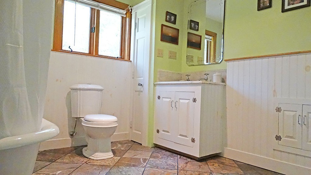 172 Braley Hill Road Rochester, MA 02770 - Photo 16 of 28 a bathroom with a toilet sink and mirror
