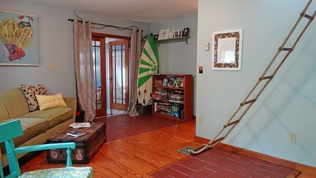 172 Braley Hill Road Rochester, MA 02770 - Photo 21 of 28 a living room with furniture and wooden floor